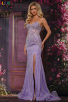 Colors Dress 3929 in Lavender with stone tape linear beading, cat-eye neckline, and thigh-high slit.