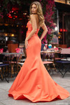 Sherri Hill 57008 in Orange showcasing the dramatic mermaid silhouette and flared taffeta skirt from the back.