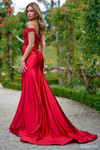 Sherri Hill 56964 in Red with ruched satin skirt and fitted silhouette.