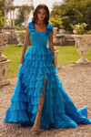 Sherri Hill 57215 in Light Blue with square neckline, bow straps, and tiered ruffle skirt.