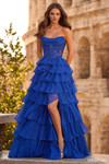 Sherri Hill 57497 in Royal Blue with sheer embroidered lace corset, cowl drape neckline, and tiered ruffle skirt with slit.