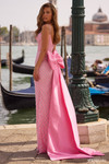 Sherri Hill 57560 in Candy Pink/Ivory/Silver showcasing the dramatic detachable satin back bow and fitted silhouette.