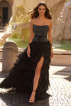 Sherri Hill 57891 in Black with strapless corset bodice, exposed boning, and ruffle chiffon skirt