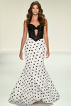 Sherri Hill 57932 in Black/Ivory with lace corset bodice and polka-dot mermaid skirt.