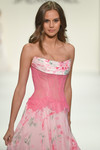 Sherri Hill 58002 close-up in Pink Print with sheer dropped waist lace corset and cowl drape detail.