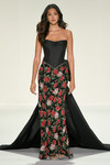 Sherri Hill 67204 in Black Print with satin corset bodice, floral beaded skirt, and sweeping taffeta cape.