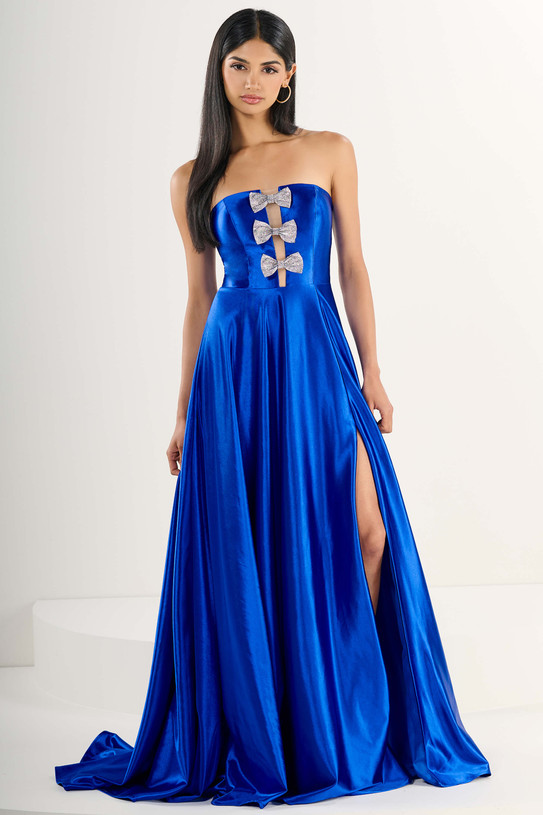 Tiffany Designs 16289 in Royal Blue — front view with strapless straight neckline, three embellished bows, and A-line skirt with slit.