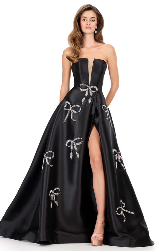 Ashley Lauren 12207 in Black with crystal and pearl bow embellishments and thigh-high slit.