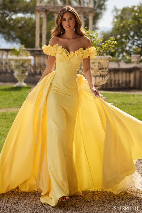 Sherri Hill 57200 in Yellow with off-the-shoulder 3D floral neckline and fitted corset bodice.