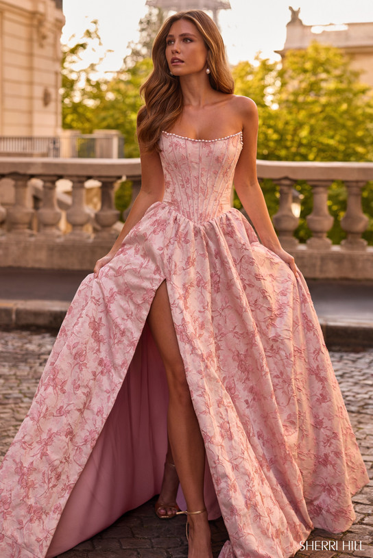 Sherri Hill 57752 in Light Pink with pearl-trimmed strapless neckline and thigh-high slit.