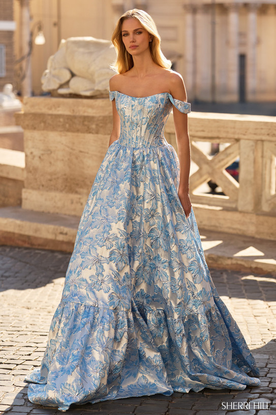 Sherri Hill 57918 in Blue with floral brocade fabric and detachable off-the-shoulder straps.