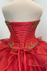 Lace-up corset back detail of Davinci Red Gold gown