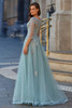 Back view of La Femme 33536 A-line gown with sheer sleeves