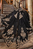 Black and gold quinceanera gown with statement bow streamers, back view