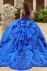 Royal blue quinceanera gown with oversized bow and scalloped train, back view