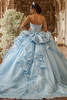 Sky blue quinceanera gown with tiered train and oversized bow, back view