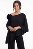 Detail view of asymmetrical neckline and shoulder flower on K288073