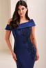 Close-up of Montage M4214 asymmetrical neckline with lace appliqué and beading