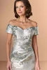 Close-up of Christina Wu Elegance 17292 jade off-the-shoulder neckline and draped bodice.