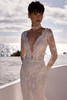 Close-up of Adora plunging illusion neckline with beaded lace sleeves