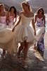 Bride wearing the Arabela high-low wedding dress at a reception