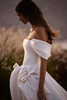 Side view of Elara bridal gown featuring oversized 3D waist bows