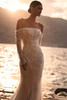 Side view of Emerald beaded wedding gown with off-the-shoulder sleeves