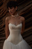 Close-up of Lumiere shell neckline and satin corset bodice
