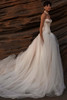 Side view of Lumiere wedding dress with flowing tulle train