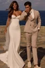 Bride wearing Milla Nova Mirela satin wedding dress outdoors