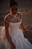 Noir bridal gown styled with statement pearl necklace