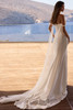 Back view of Olvia satin wedding dress with flowing tulle wing accents