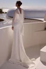 Back view of Orlaya wedding dress with tulle bolero and button detail