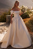 Bride wearing Valora Mikado ball gown with bouquet