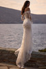 Three-quarter view of Vespera dress showing fitted mermaid silhouette
