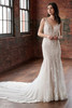 Front view of Christina Wu 15916 beaded lace fit and flare wedding dress with deep V illusion neckline