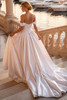 Back view of Kennedy wedding dress with detachable off-the-shoulder straps and chapel train