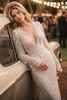 Close view of Lillian plunging V-neckline and beaded long sleeves