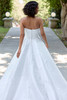 Back view of D4407 A-line wedding dress with floral lace detailing and button accents