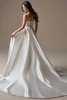 Back view of Laurie wedding dress with detachable satin overskirt and train