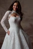Detail view of Serena wedding dress with scalloped scoop neckline and pockets