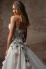 Back detail of Amaryllis wedding dress showing floral appliqués and bow details