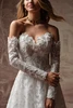 Detail view of Merrigan dress with detachable lace long sleeves and 3D flowers