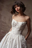 Close front view of Petra dress showing cat-eye neckline and 3D lace
