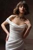 Close front view of Recine dress showing asymmetrically draped portrait neckline