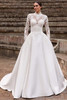 Front view of Pronovias Baies Chantilly lace wedding dress with overskirt