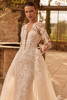 Front detail of Centia dress showing plunging neckline and lace sleeves