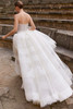 Back view of Etaga detachable lace overskirt wedding dress