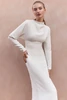 Detail view of Pronovias Neissia wedding gown with softly draped high neckline and long sleeves