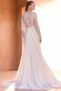 Back view of Ohiane wedding gown with sheer illusion lace back, covered buttons and flowing train